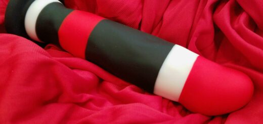 Blush Novelties' Avant D5 is a dildo with red, black, and white stripes.