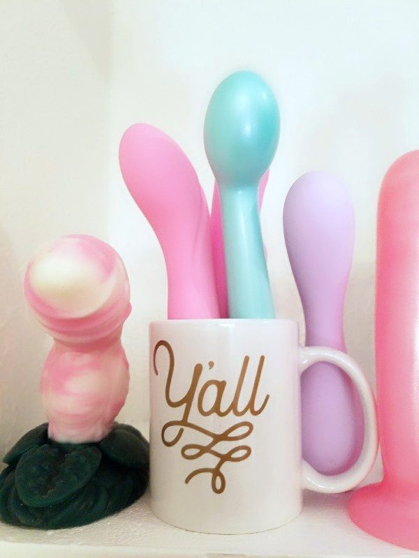 [I resettled in the south, so... of course I had to get the mug that said "y'all" to hold my vibrators]