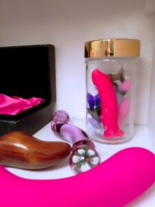 Hard material sex toys, plus a jar of teeny weenies / tiny dildos from Funkit Toys.