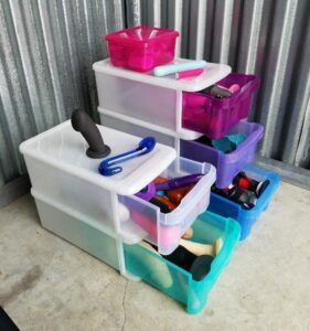 You can find these colorful stackable drawers at The Container Store. They add a pop of color and making storing anything fun