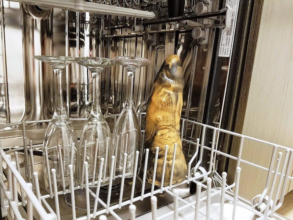 Frisky Beast / Twin Tail Creations Cybersaur dildo in dishwasher next to wine glasses