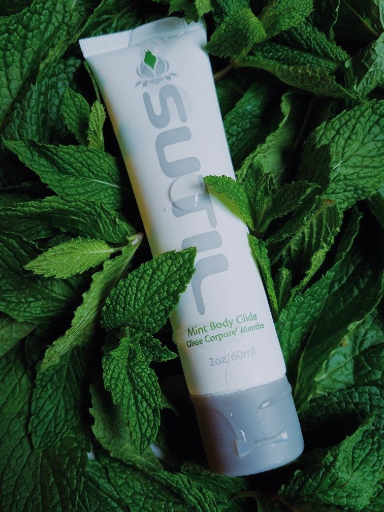 Hathor / SUTIL Body Glide mint flavour lube tube among mint leaves
