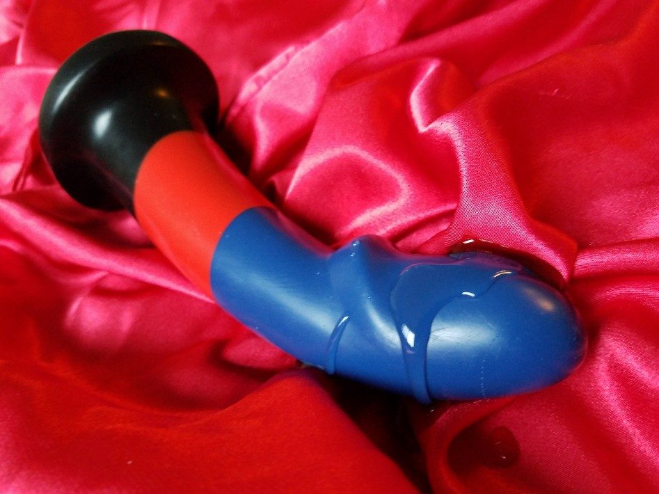 BS Max Poly Pride striped silicone A-spot and G-spot dildo with lube on it