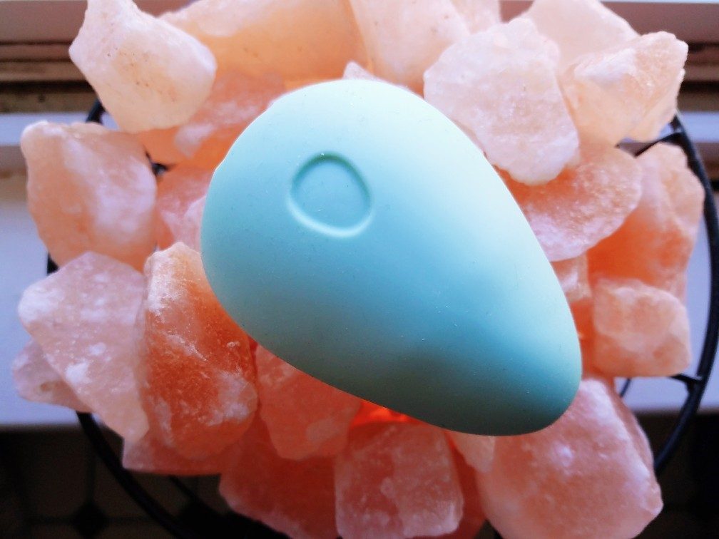 Dame Products Pom jade green vibrator back view: on/off/pattern toggle button