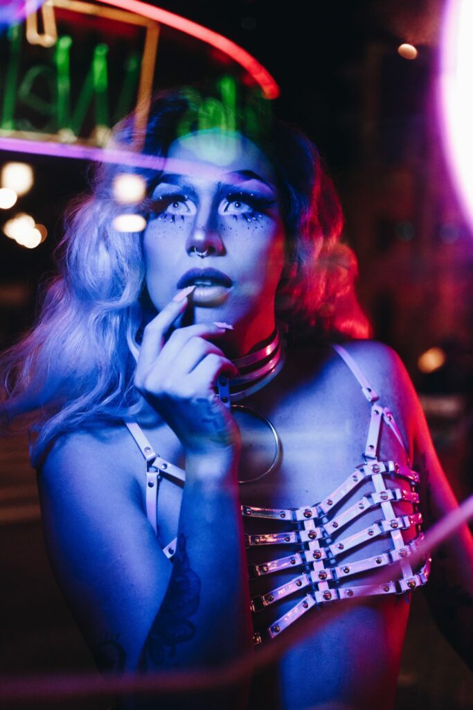 3 Reasons I Want More Body Mods 2 Woman with leather chest harness bra, party makeup, and septum ring