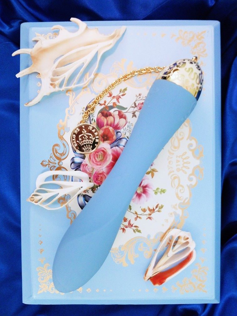 Image: Zalo Marie blue on storage box amid sliced seashells