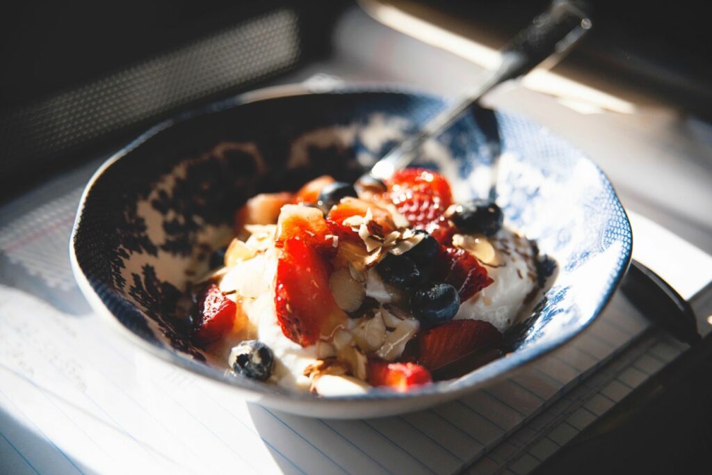 [Image: a cup of yogurt with strawberries and blueberries]