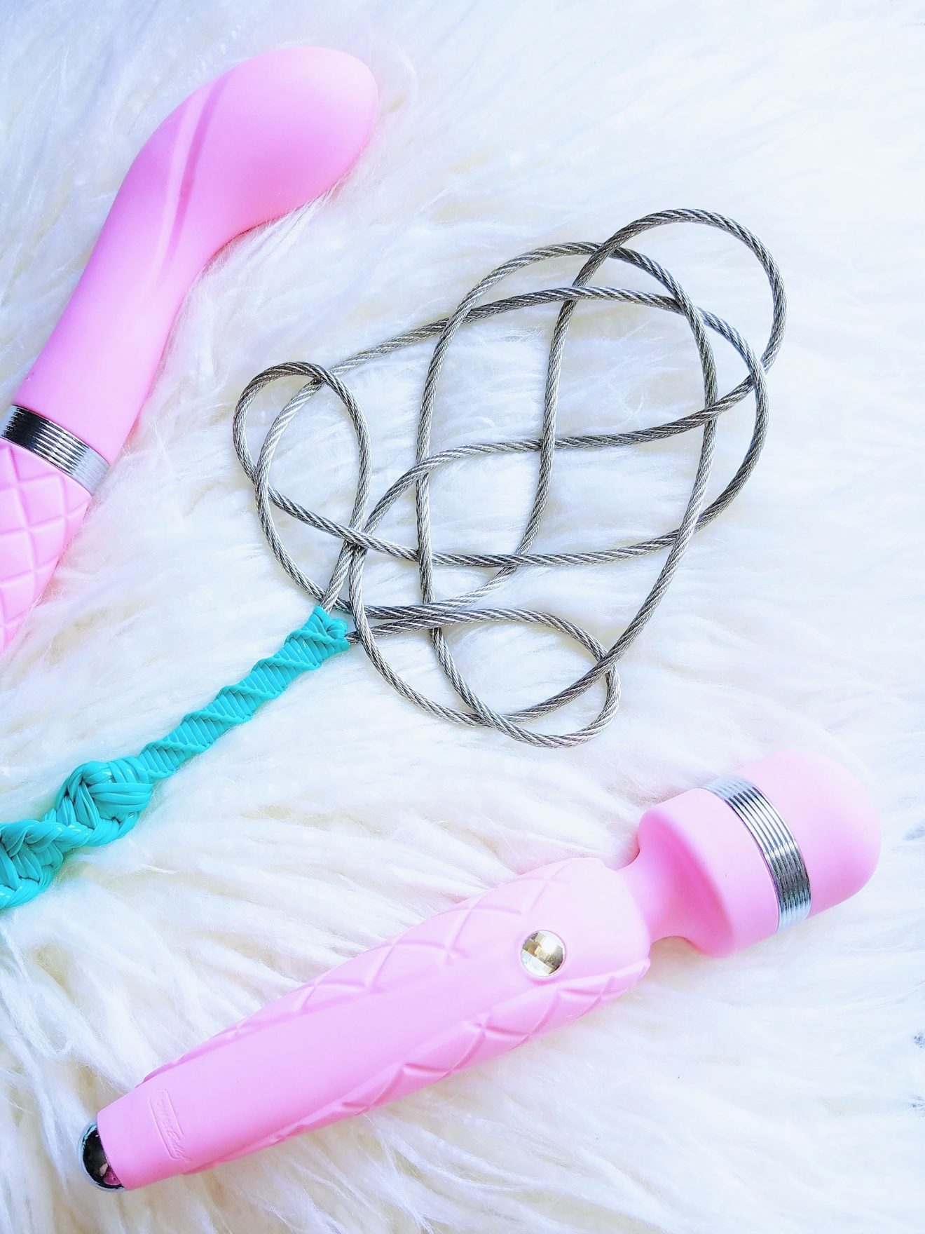 [Image: Pillow Talk Sassy next to Pillow Talk Cheeky and Kink Nerd Toys rug beater paddle]