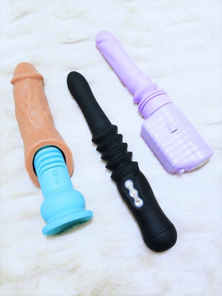 [Image: a mint green mini Velvet Thruster Teddy with a caramel VixSkin Colossus cock extension sleeve on top of it. Next to the Teddy is a black Maia Max and a purple Velvet Thruster Jackie. The Teddy is available in black, lilac, wine red, AND mint green. Fuck yeah!]