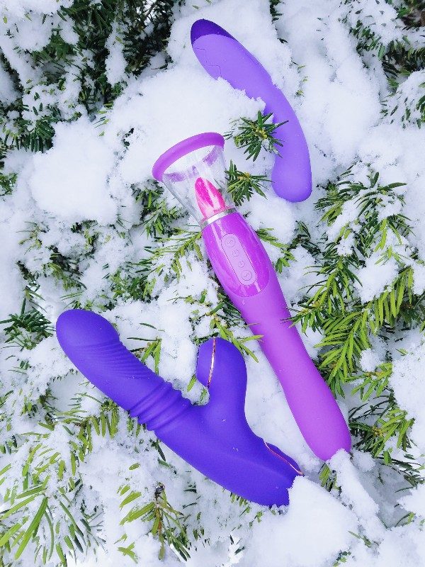 [Image: purple Blush Lush Iris, Pipedream Fantasy For Her Ultimate Pleasure, and Blush Wellness G vibrators on snowy evergreen]