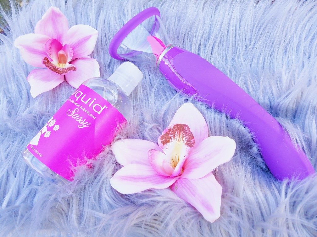 [Image: Fantasy For Her Ultimate Pleasure suction and licking vibe 3/4 view next to Sliquid Sassy pink lube bottle]