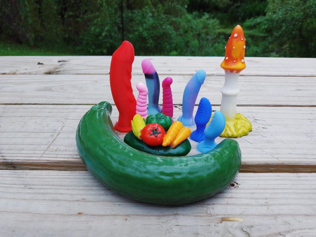 [Image: Self Delve Curved Cucumber and Fly Agaric next to colorful and tiny Funkit and Fun Factory dils]
