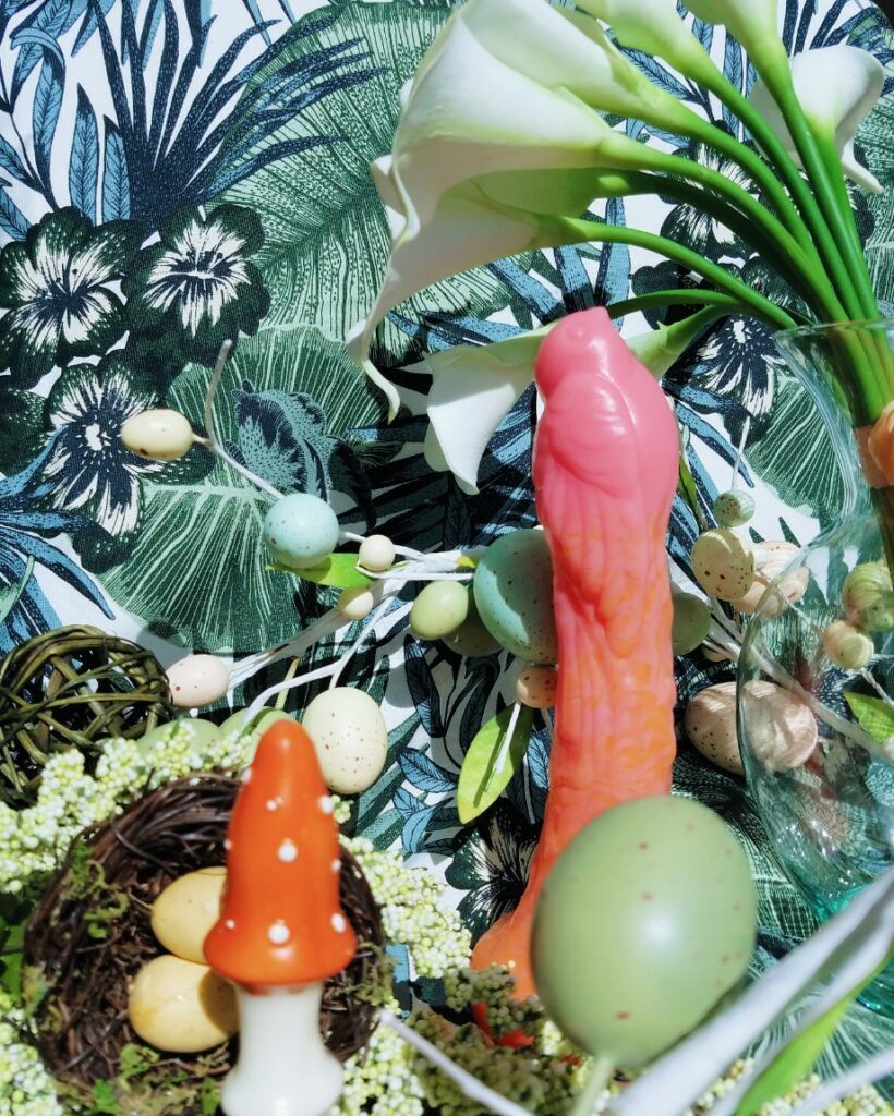 [Image: Self Delve Amanita Muscaria / Fly Agaric mushroom butt plug next to pink and orange gradient Silc Arts Sparrow and Easter egg decorations]