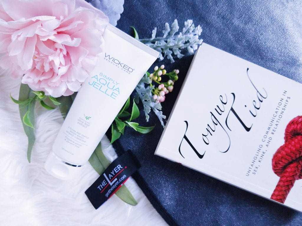 Wicked Simply Aqua Jelle water-based lube, The Layer waterproof sex blanket, and Tongue-Tied by Stella Harris Review
