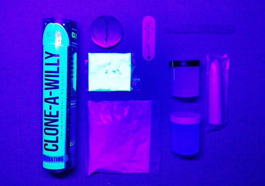 Clone-A-Willy at-home silicone dildo casting kit: packaging, glow powder, molding powder, thermometer, tongue depressor, silicone, catalyst, plastic bullet vibrator