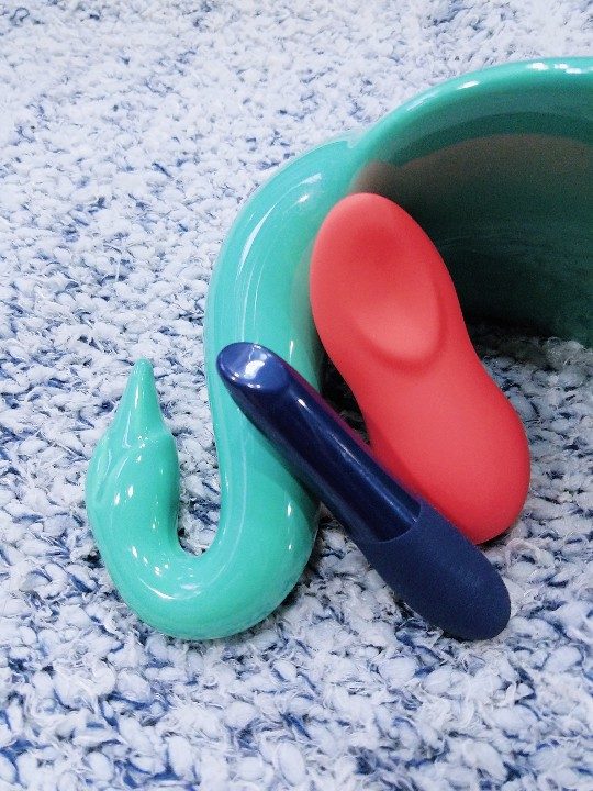 We-Vibe Tango X and Touch X bottom view of lipstick slant and clitoral lay-on nestling "spoon"