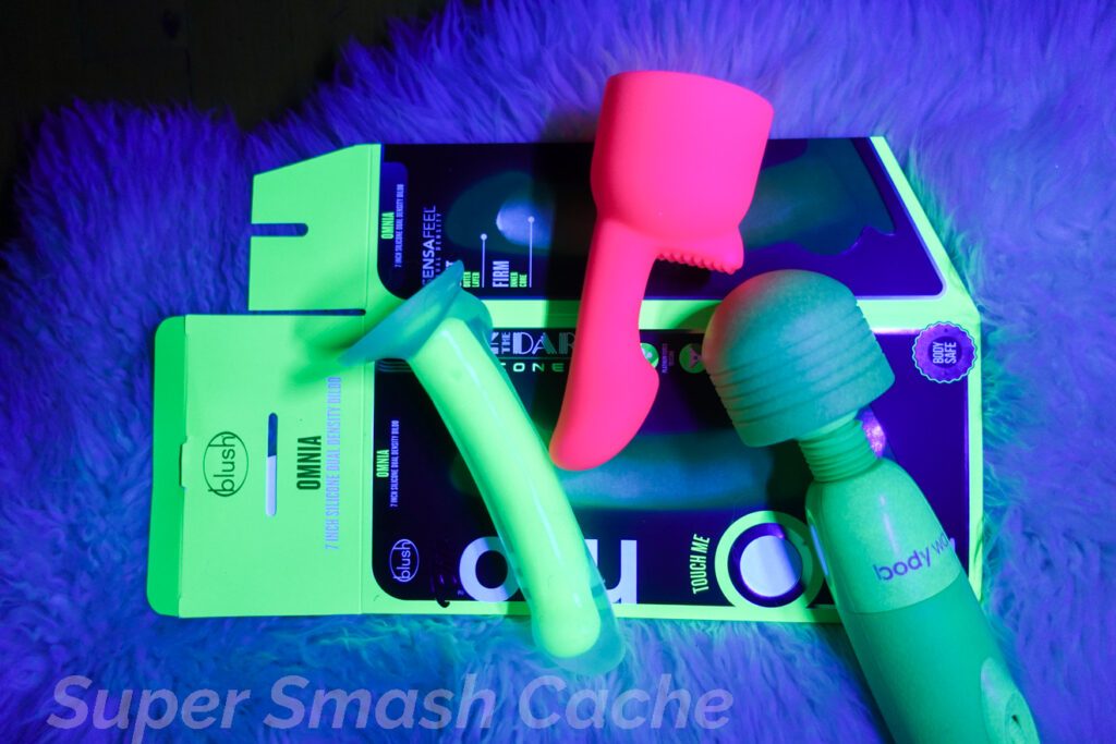 Glow-in-the-dark sex toys: Blush Neo Elite GLOW Omnia dual-density dildo, glow-in-the-dark Bodywand, Ultra G-Touch attachment