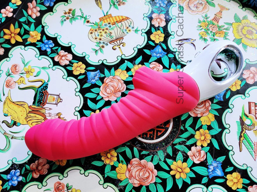 The Fun Factory Tiger G5 is a rumbly vibrator with JUICY AF ribbing all along the shaft. Its handle is a white loop made of ABS plastic for easy grabbing, while the insertable portion is medical-grade silicone. The shaft's textures form stripes, hence the Tiger G5 name, while the tip vaguely resembles a penis with foreskin.