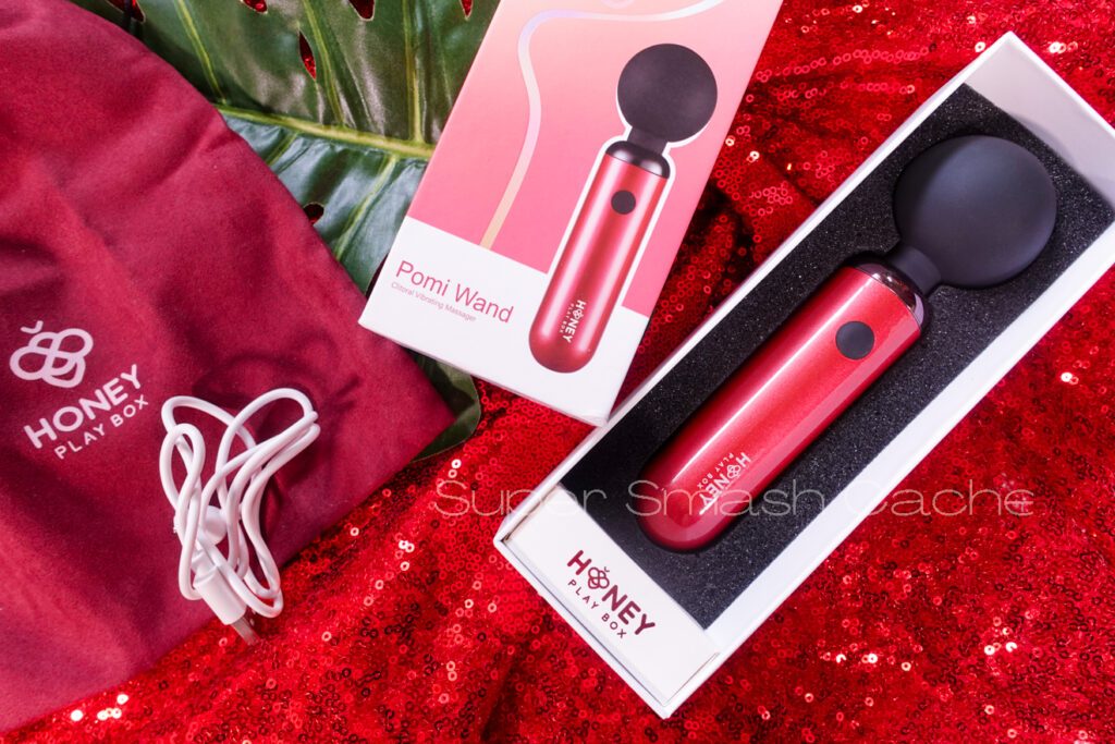 Honey Play Box Pomi mini wand packaging, charging cord, and storage bag