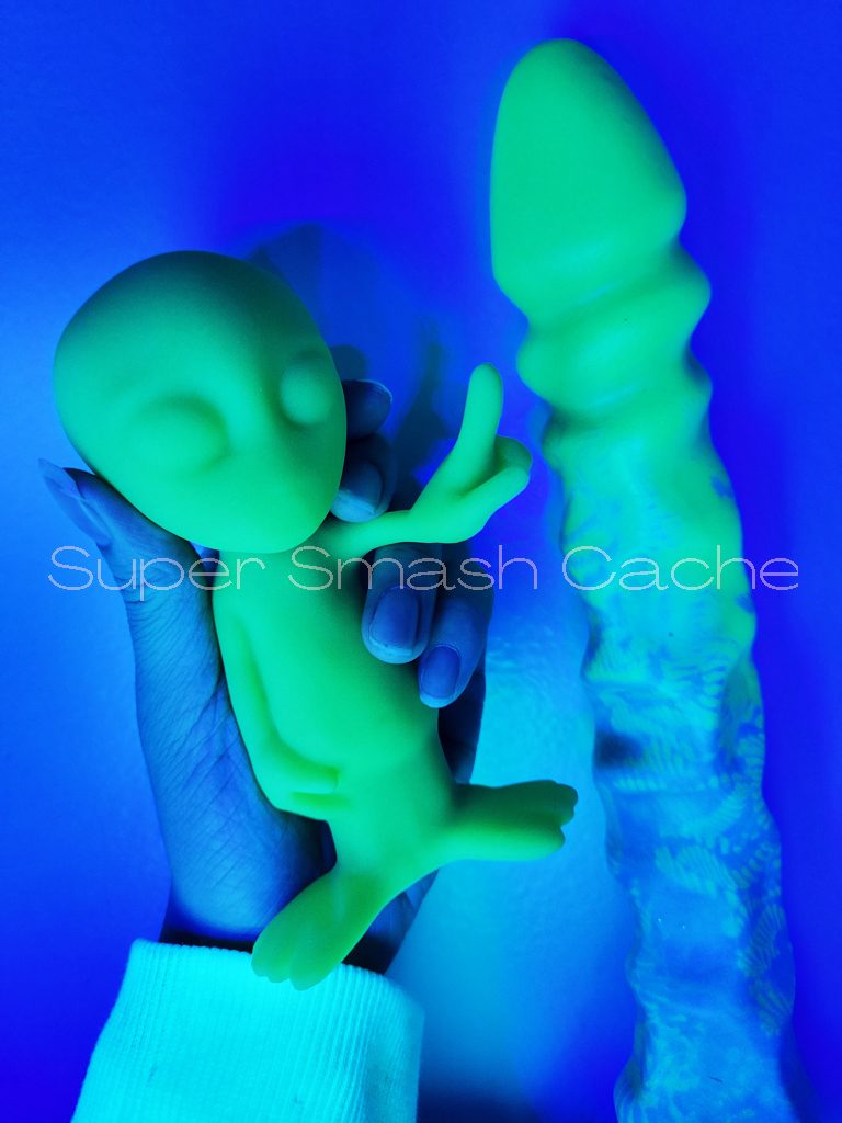 5 Reasons to Adore Uberrime Dildos 8 Voila Bob the Alien vibrator next to Uberrime Alien Probe Thing dildo