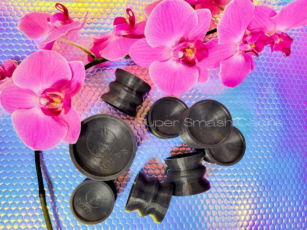 Lust Arts double-sided silicone suction cups serve as an adapter. That's how to stick a flat-based dildo to the wall