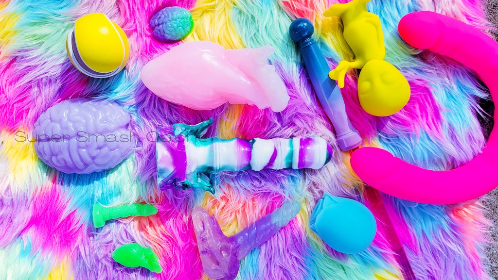 Pastel-colored silicone dildos and massagers by Velvet Alley, Voila, Chaotic Kink, and more