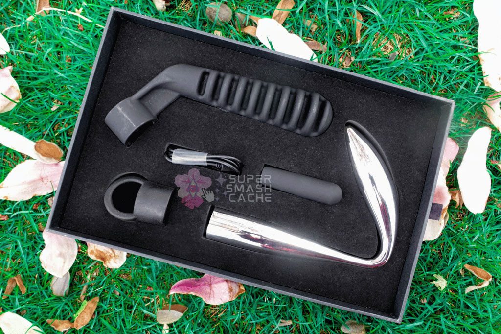 All L'Acier metal dildos come in sturdy boxes with velvet-flocked foam inserts and slots for the toy itself, a bullet vibrator, charging cord, loop handle, and angled long reach handle