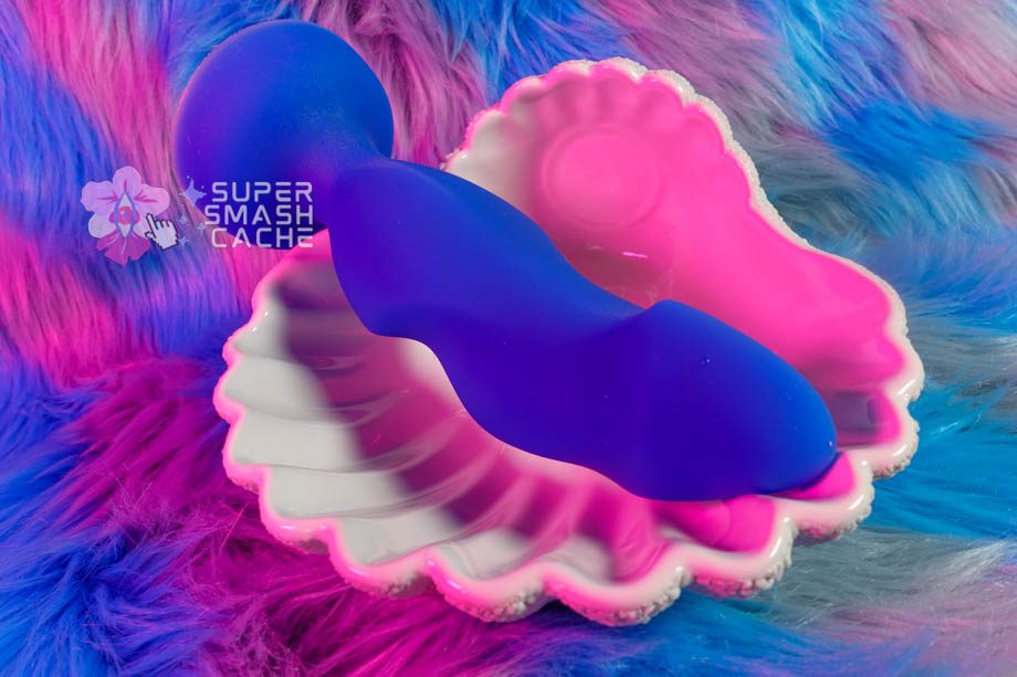 Topped Toys Hilt 75 dildo inside giant ceramic seashell for display
