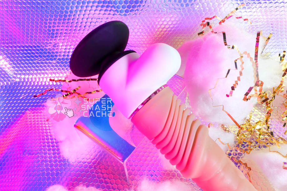 Velvet Thruster Prime Edward self-thrusting dildo with accordion shaft, stylized testes-like battery compartment, and removable suction cup