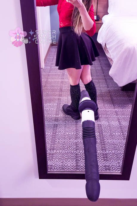 Posing with the Velvet Thruster Prime Sammie compact fucking machine suction cupped to a mirror