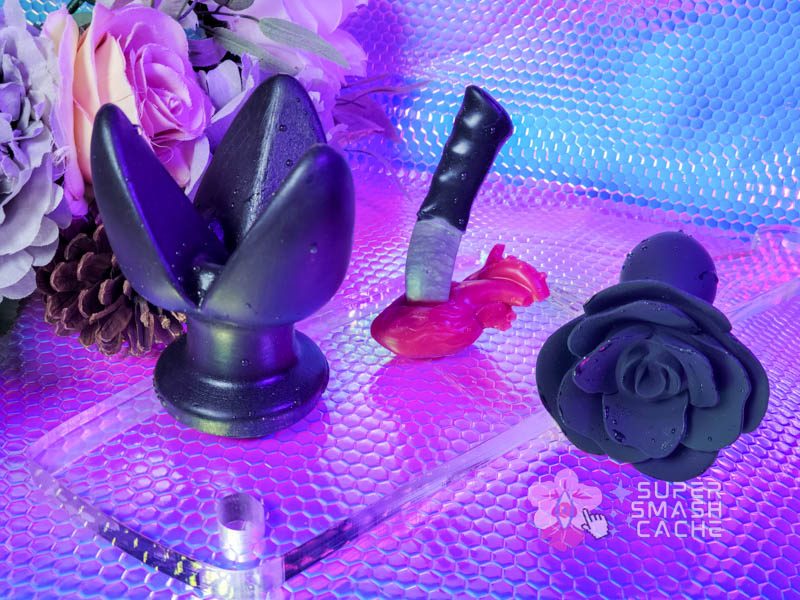 Black rose silicone butt plugs: Oxballs Rosebud plug and Love to Love Open Roses 