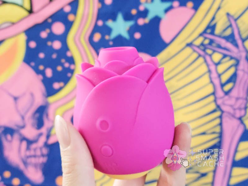 ROMP rose massager with extended nozzle in fuchsia with yellow base