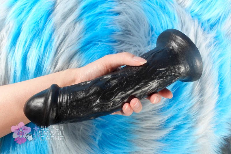 VixSkin Cash large realistic dildo in hand