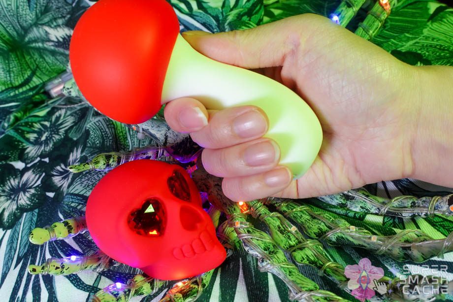 Mini-Reviews: Maia Shroomie & Naughty Bits Bone Head Skull Vibrator 2 Naughty Bits Bone Head skull vibrator with rhinestone heart eyes and Maia Shroomie thick mini-vibrator in hand for size comparison