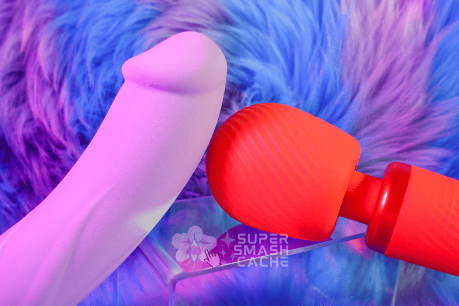 3 Rumbly Blowjob Vibrators For Fantastic Fellatio: Manta, Vim & Bond Review 7 Fun Factory Vim Wand against underside of Big Boss Jewels edition vibrating dildo