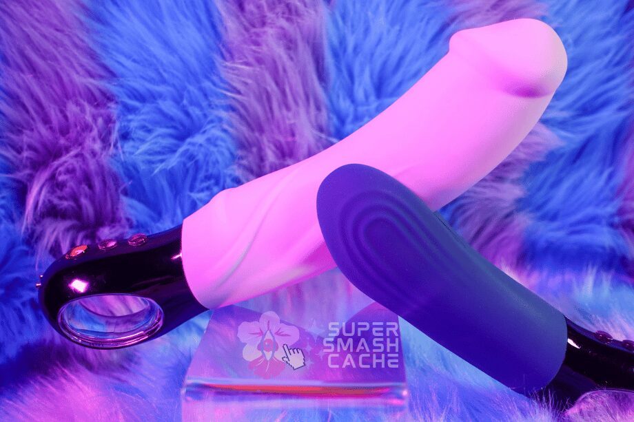 3 Rumbly Blowjob Vibrators For Fantastic Fellatio: Manta, Vim & Bond Review 2 A We-Vibe Manta against the underside of a realistic penis-like vibrating dildo