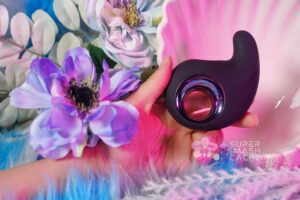 The Orb Vibrator Review: PLASMA RAYS & Dual Motors?! 4 My hand holding the Playboy Pleasure Ring My Bell shallowing vibrator from the side view