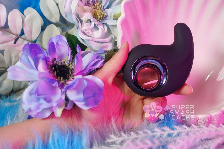 My hand holding the Playboy Pleasure Ring My Bell shallowing vibrator from the side view