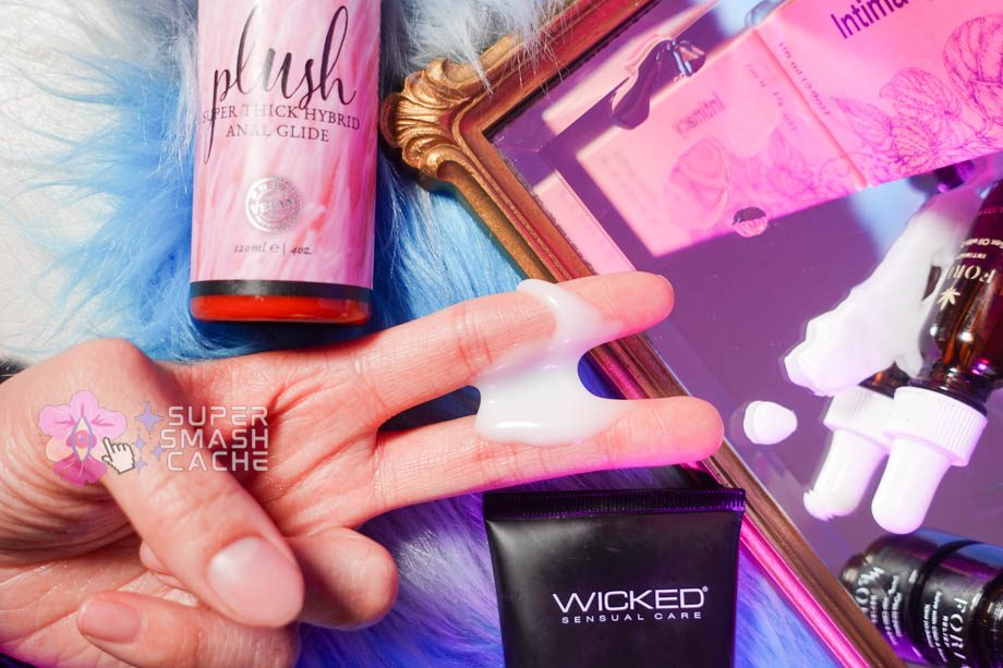 Cum-like hybrid silicone and water lube between fingers, plus massage gel and CBD  body care