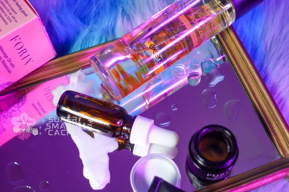 Massage cream and oil in glass bottles