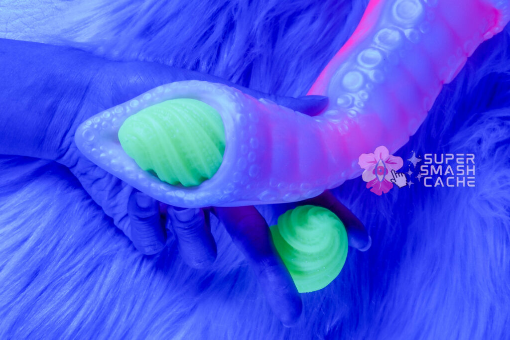 Squeezing Uncover Creations tentacle ovipositor tip with green UV glow alien textured eggs