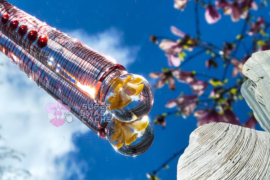 Glass dildo handle with flower embedded