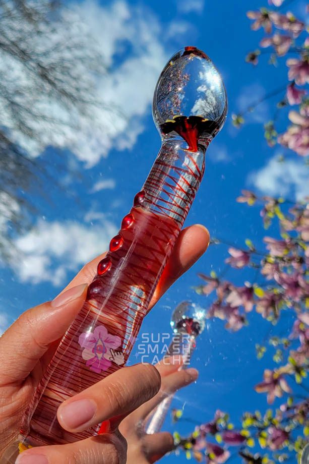 Hand holding A-spotty glass dildo massager