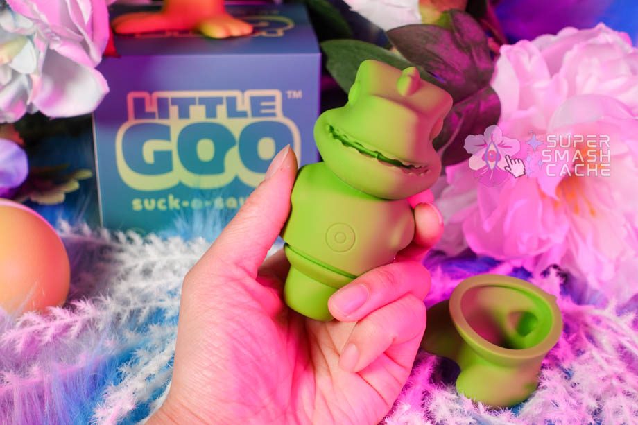 La Boutique Voila Little Goo discreet dinosaur clitoral suction toy in hand