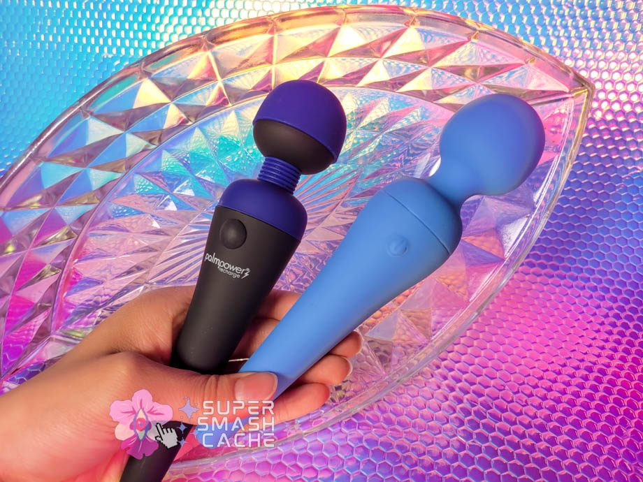 A hand holding the BMS PalmPower Recharge and California Exotics Couture Collection powerful compact massagers