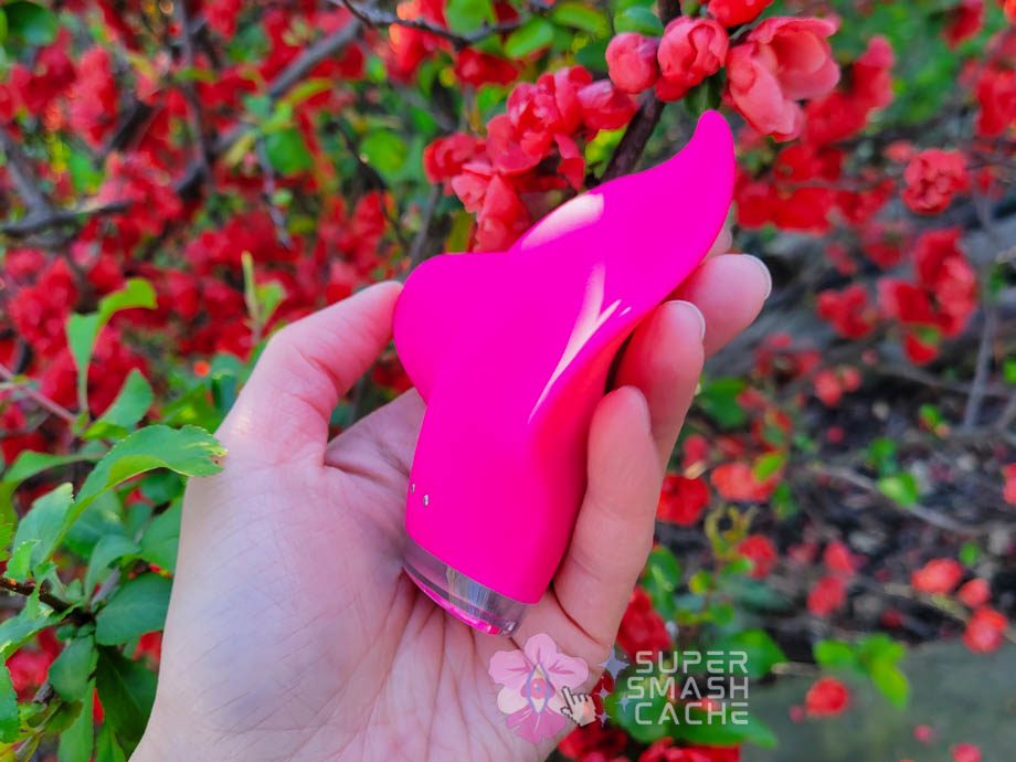 A hand holding a pink Clandestine Devices Mimic+ Plus vibrator 3