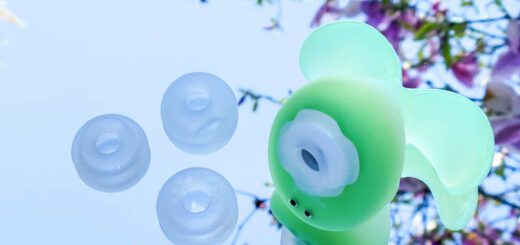 Translucent green Dream Bunny air pulse toy from Pink Punch and suction attachment heads