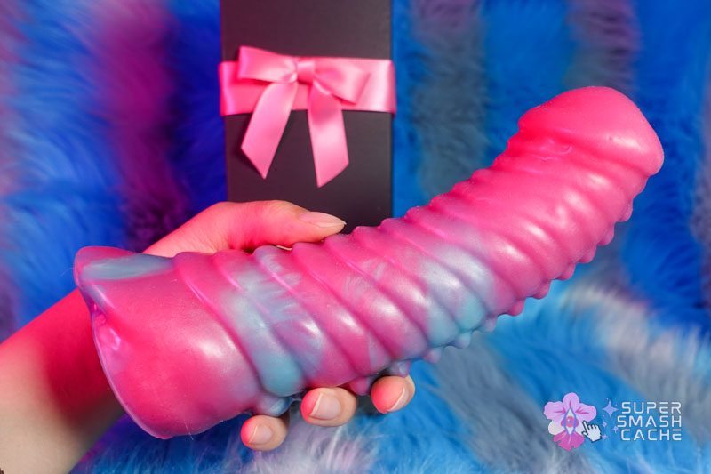 KinkyPop Toys Thexomite Dildo Review: thick, INTENSE textures! 9 KinkyPop Toys Thexomite dildo in hand with wrist size comparison