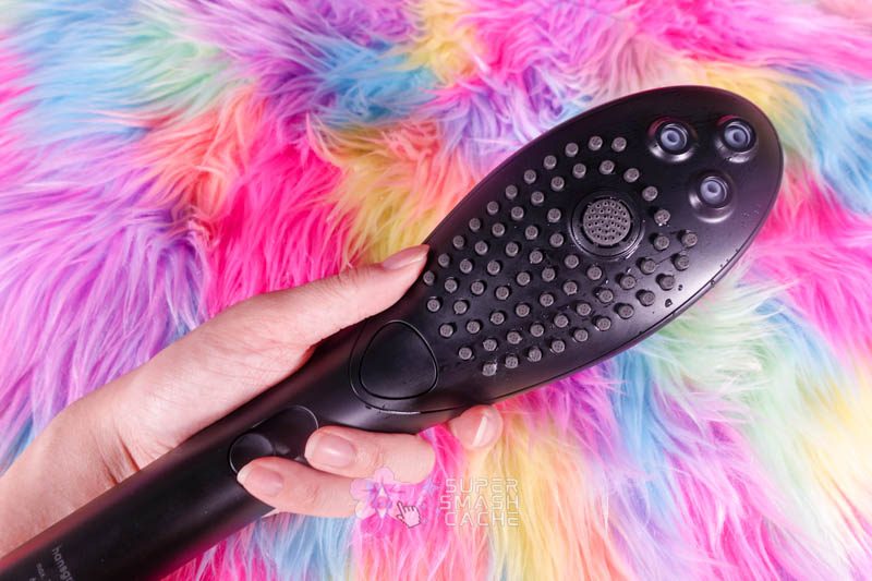 Okay, Fine: The Womanizer Wave Showerhead Grew on Me. 3 Black Womanizer Wave showerhead in hand