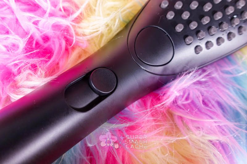 Okay, Fine: The Womanizer Wave Showerhead Grew on Me. 2 Black Womanizer Wave showerhead button and dial controls